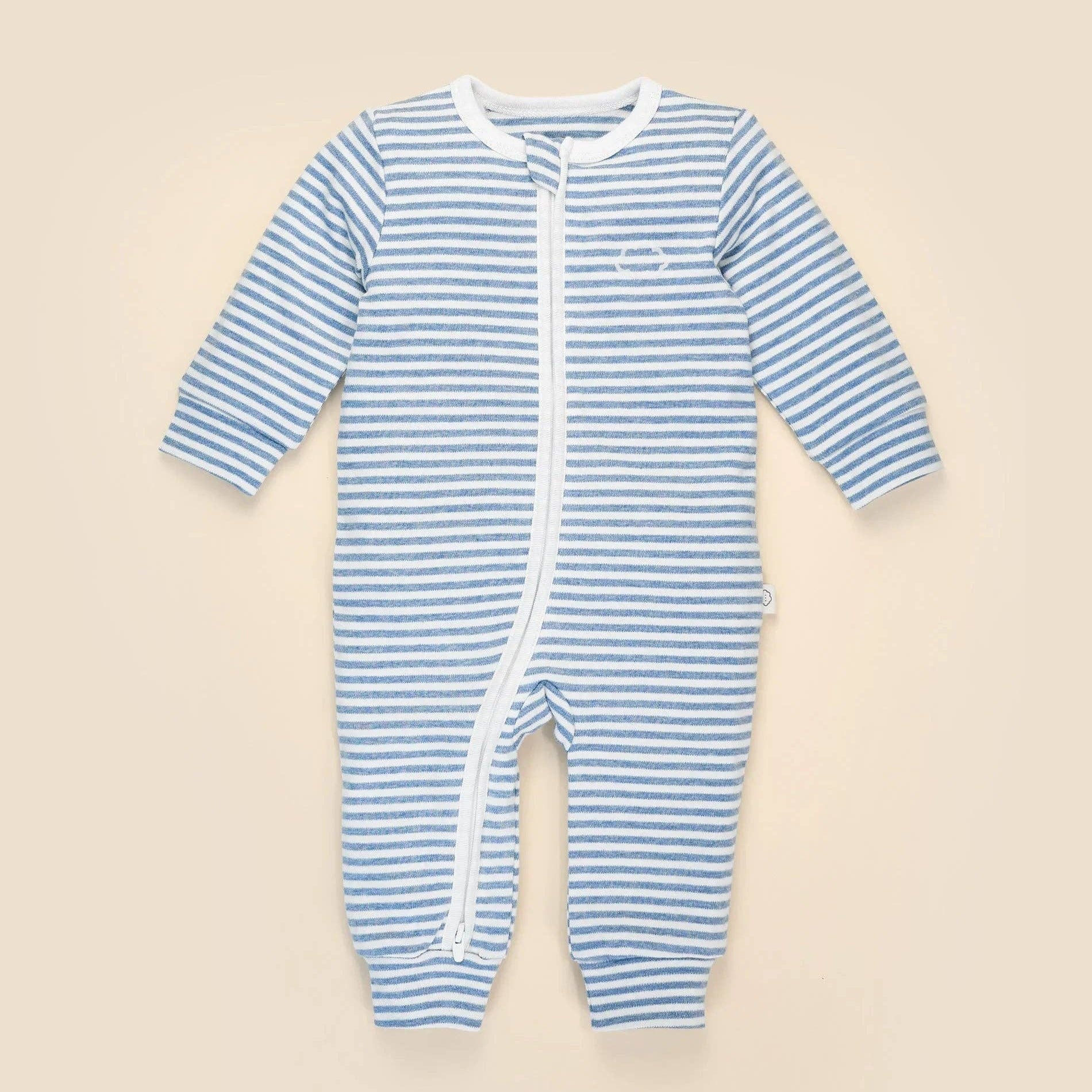 Blue and white striped baby onesie on a beige background