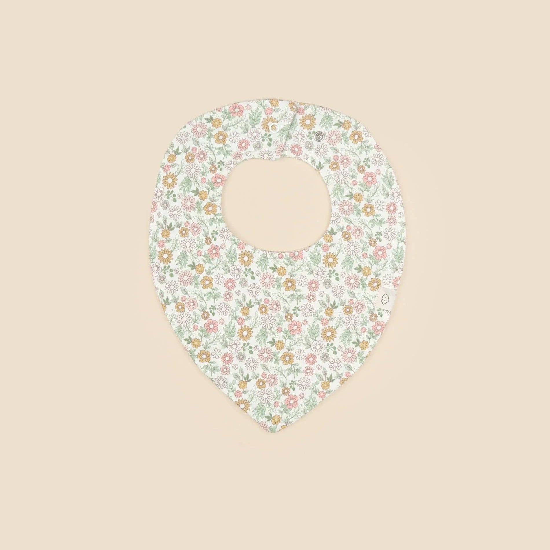Floral patterned bib on a beige background