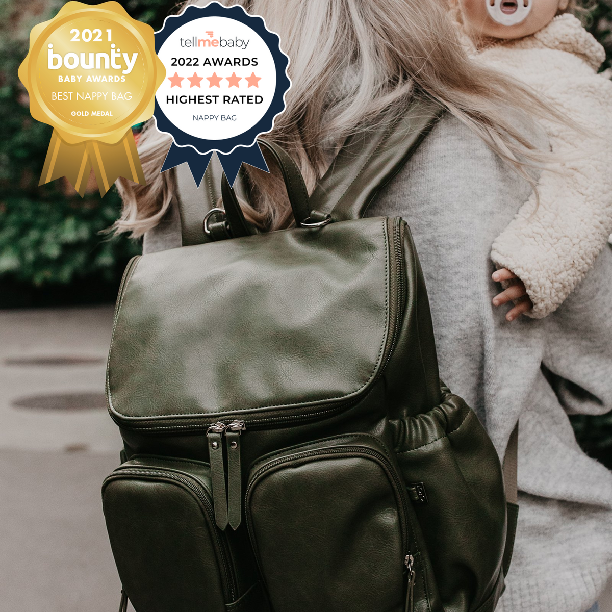 Person holding a green backpack with awards displayed above